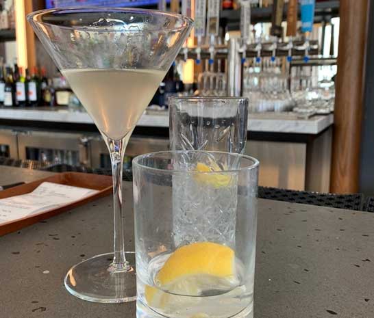 elegant Martini and drink in glass on bar