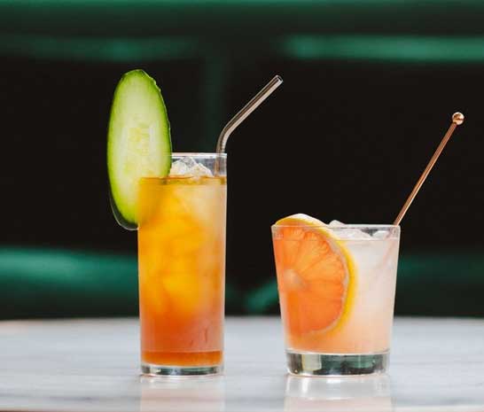 two fruit infused cocktails